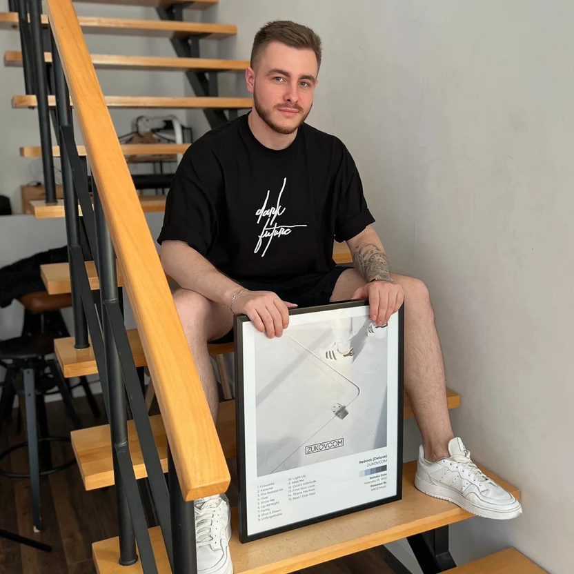 Framed album poster in a living room